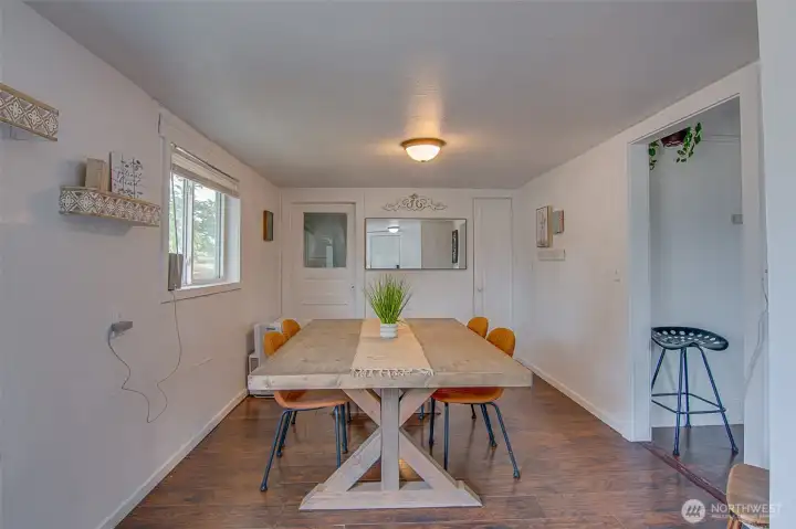 Dining room has a closet for and door to basement for more storage.