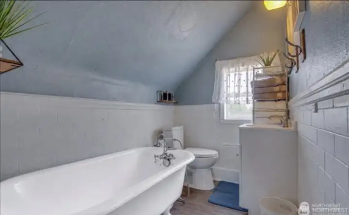 Upstairs bathroom has a clawfoot tub
