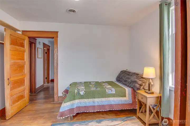Comfortable bedroom with classic wood doors and warm character