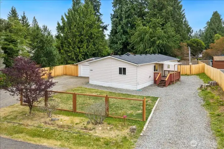 A welcoming property with abundant parking, a detached garage, and plenty of room to enjoy both work and play.