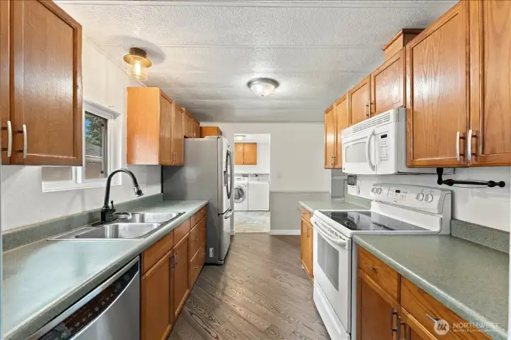 Flowing seamlessly into the dining area, this cheerful kitchen is ready for everything from morning coffee to family dinners.