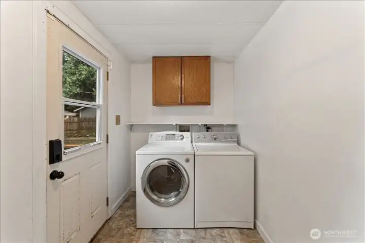 A dedicated laundry and mudroom provides extra storage and convenient access to the backyard.