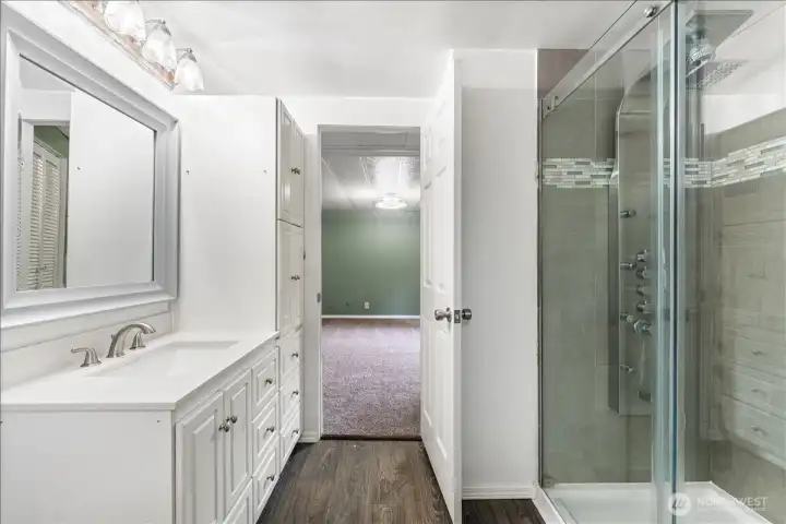 A large vanity with abundant storage creates a bright and practical space for your daily routine.