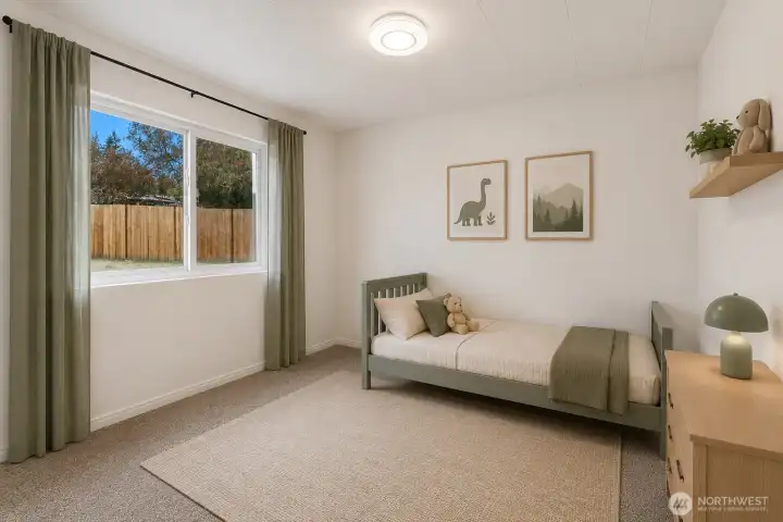 Imagine ending each day in this serene bedroom, thoughtfully staged to showcase its comfortable proportions.