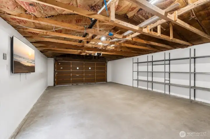 The detached garage provides exceptional space for parking, hobbies, storage, or a workshop.