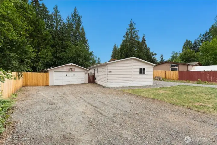 Wide gravel driveways and expansive outdoor space offer flexibility that's hard to find.