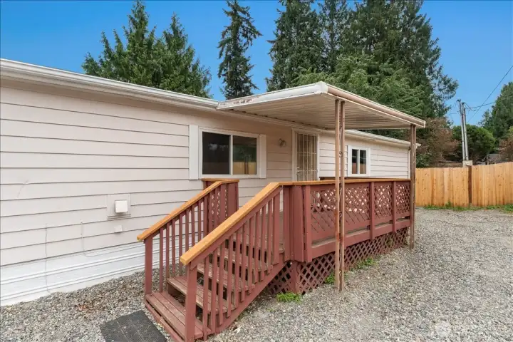 Step onto the inviting covered porch, perfect for enjoying your morning coffee or relaxing at the end of the day.