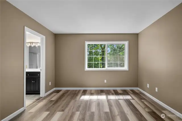 Primary bedroom with its own bath located on the back side of the house.