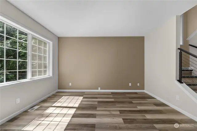 Full view of the family room that looks over the back deck and wooded yard.