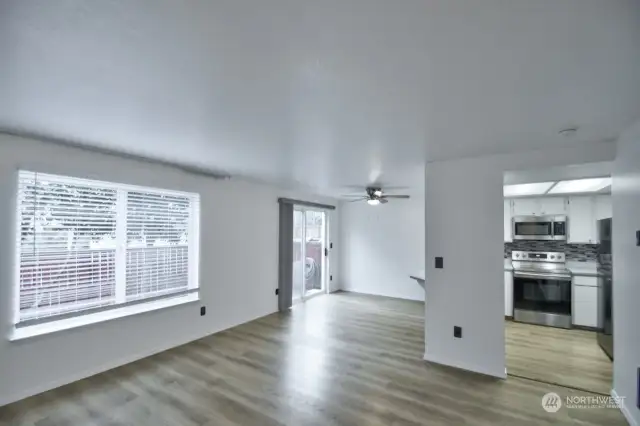 Living room opens to the dining area and kitchen.