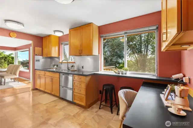 The kitchen connects easily to the dining room and to the outdoor deck. It is the heart of this house!