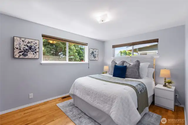 Primary bedroom with windows that create privacy.