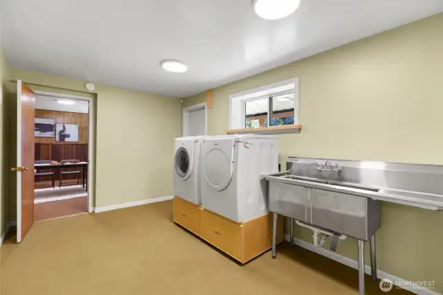 Laundry area with commercial grade sink.