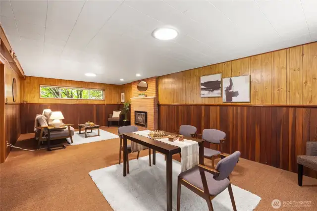 This daylight basement has so much potential. Imagine watching the games on the big screen, get a fire going in the fireplace and play board games too.