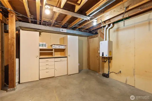 Check out this bonus room which has been a storage space and also hosts the on-demand water heater.