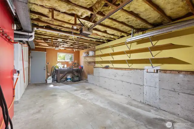 Deep single car garage with EV charging and a ton of storage built in.