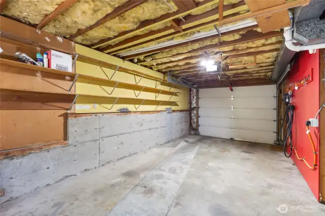 Single car garage with access to the house near the garage door. So easy to unload groceries and run them upstairs to the kitchen.