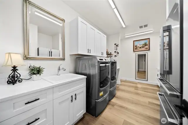 Large utility/laundry space with upgraded custom cabinetry