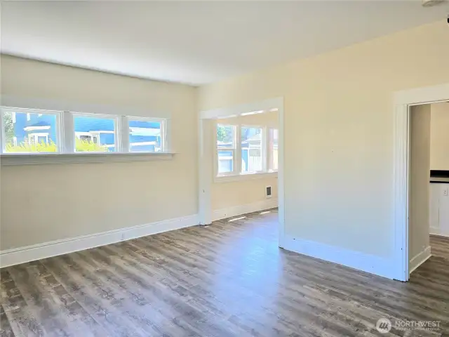 Living room to kitchen and dining, lots of windows & natural light.