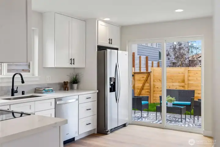 Kitchen is perfectly located to open up to the patio and yard.