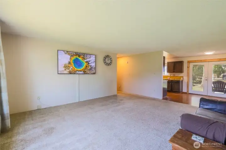Living room upon entry. TV included.