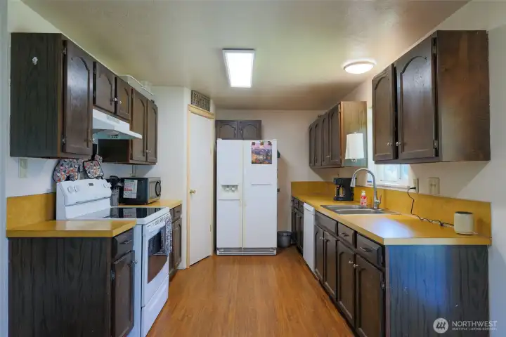 Effiicient kitchen with pantry, facing south.