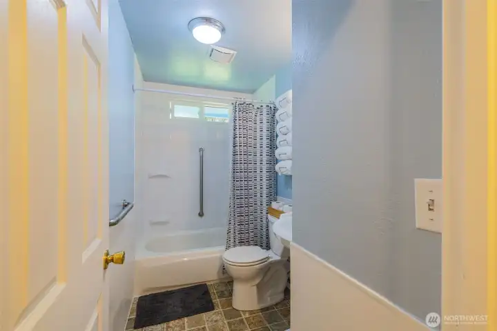 Full bathroom with grab bars.