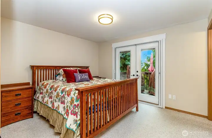 Main bedroom with private patio & 3/4 bath