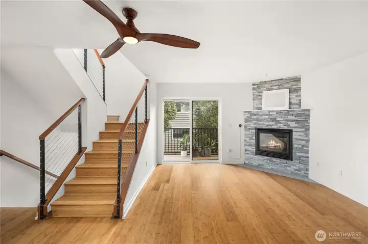 Living room with open stairway to upper floor
