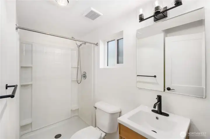 3/4 bath with large shower enclosure provides great privacy for guests