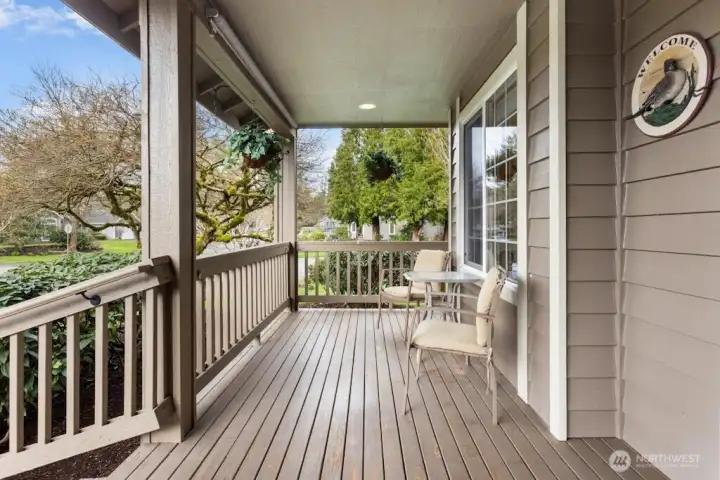 Covered front porch to enjoy your beautiful yard from.