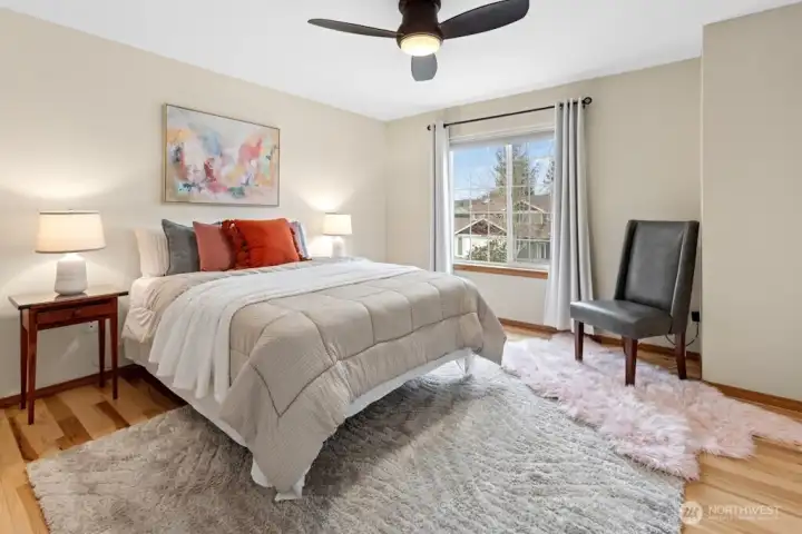 Bedroom 2 with engineered hardwoods.