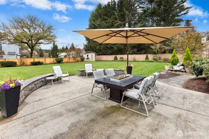 A patio made for entertaining and enjoying the immaculate backyard