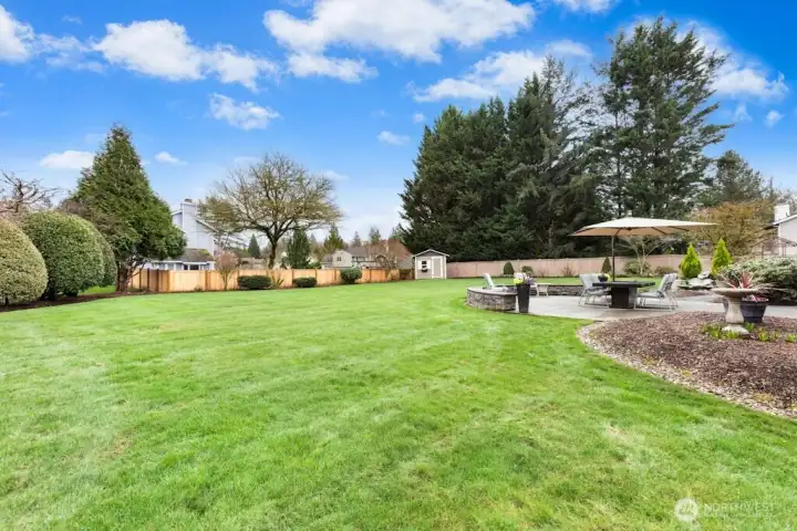 Stunning landscaping, a convenient storage shed for your lawnmower, yard tools, and more!