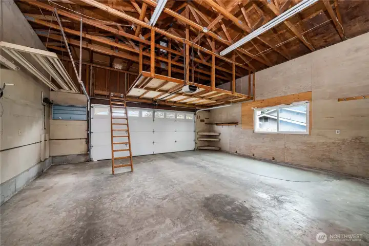Oversized two car garage with storage space.LADDER takes you up to an additional storage area sitting above the garage.