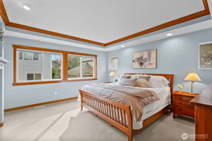 The luxurious primary suite upstairs boasts a cozy fireplace and a spa-inspired bathroom retreat.