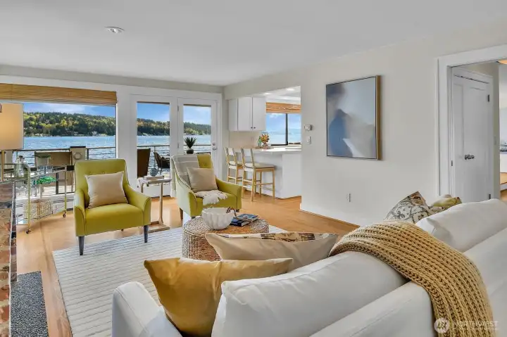 The kitchen opens to a family room or second living area.