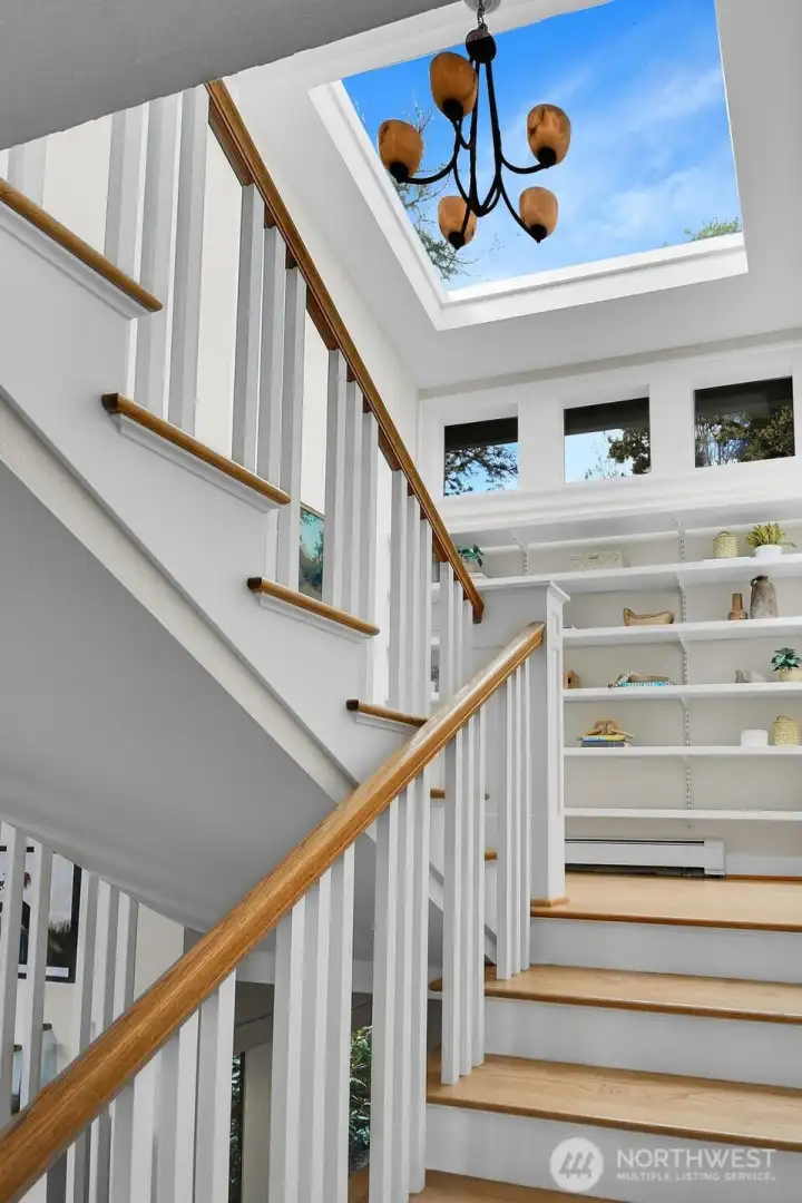 This home is 3 levels. And the stairwell includes a large skylight for a gorgeous, warm glow from above.