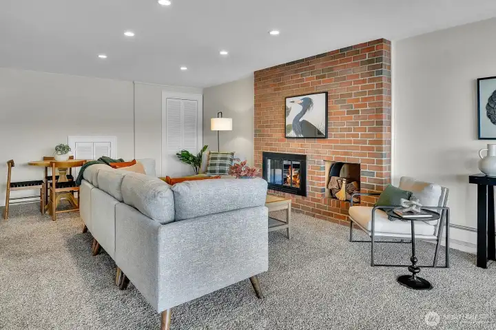 Now we're on the lower level where you'll find another spacious room. Need a recreation room or an office with a cozy wood burning fireplace?