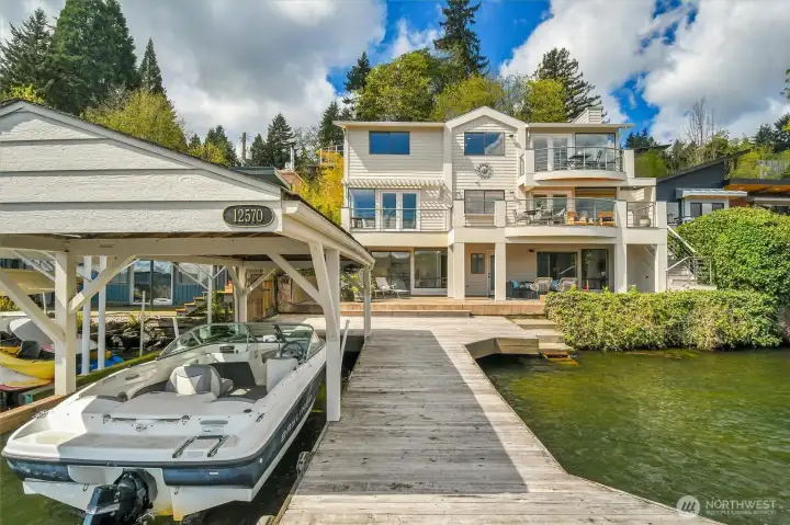 Spending time ON the lake is easy, with a private dock, a boat lift and boat house.