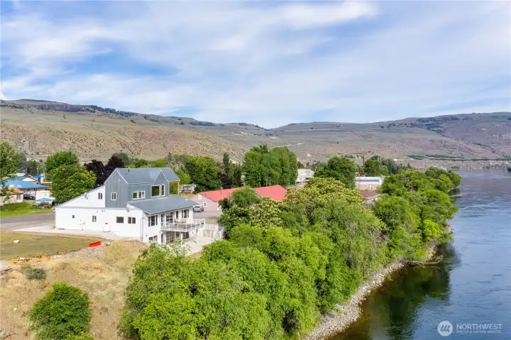 From a birds eye view of the house sitting along the shore of the Columbia.