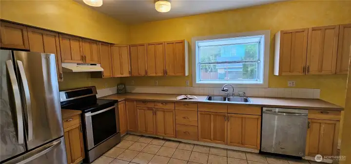 Spacious kitchen with garden window.