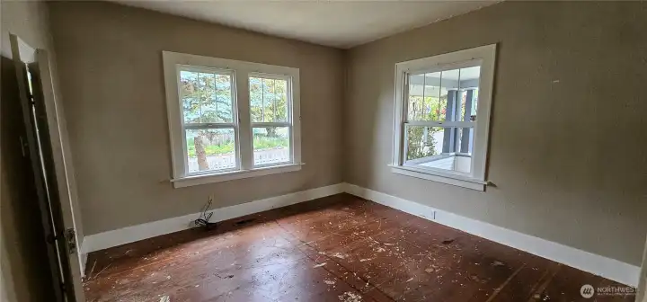 Front bedroom, room for a king sized bed. Real hardwoods can be refinished.