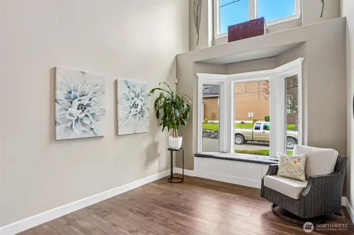 Formal living space with bench at window