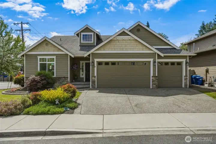 Beautiful exterior with a spacious 3-car garage.