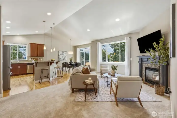 Vaulted ceilings, gas fireplace, and an open-concept floor plan.
