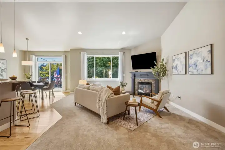 Spacious great room with a gas fireplace and abundant natural light.