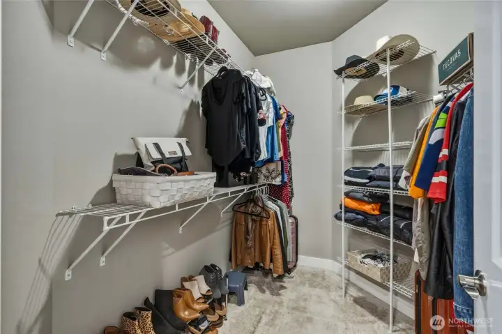 Spacious walk-in closet with ample storage.