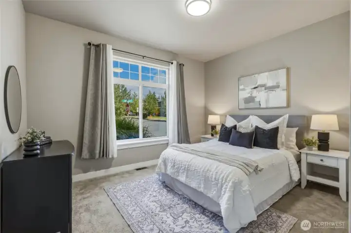 Spacious secondary bedroom with abundant natural light.