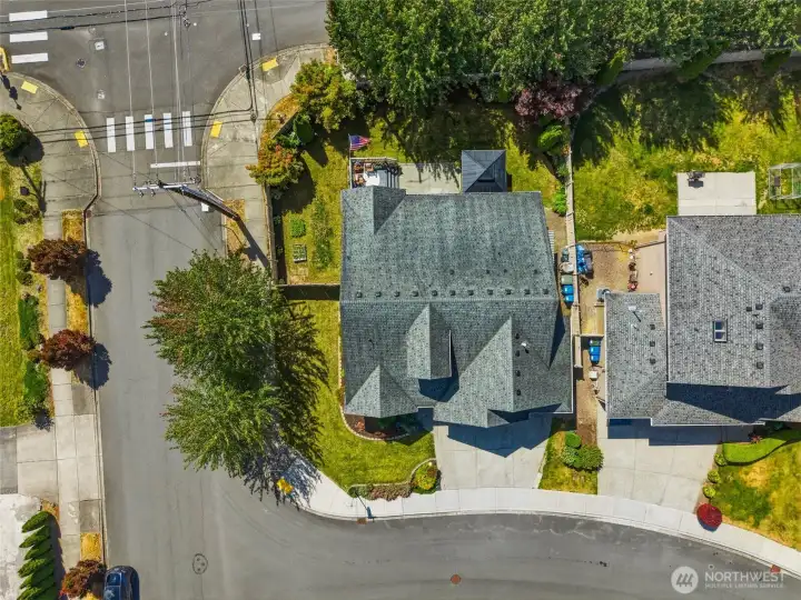 Aerial view showcasing the home’s desirable corner lot at the end of a quiet cul-de-sac, complete with a fully fenced backyard and inviting outdoor living spaces.